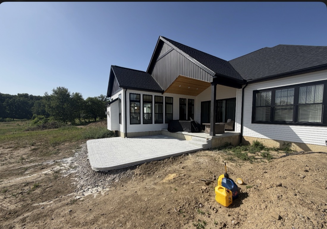 A new build with a paver patio and walkway laid by Pristine Landscaping
